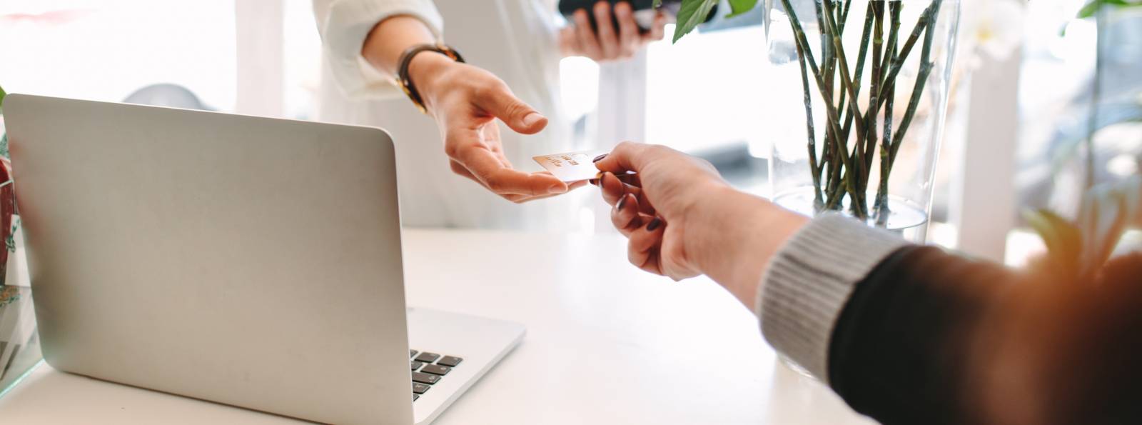 a person using their debit card to make a purchase