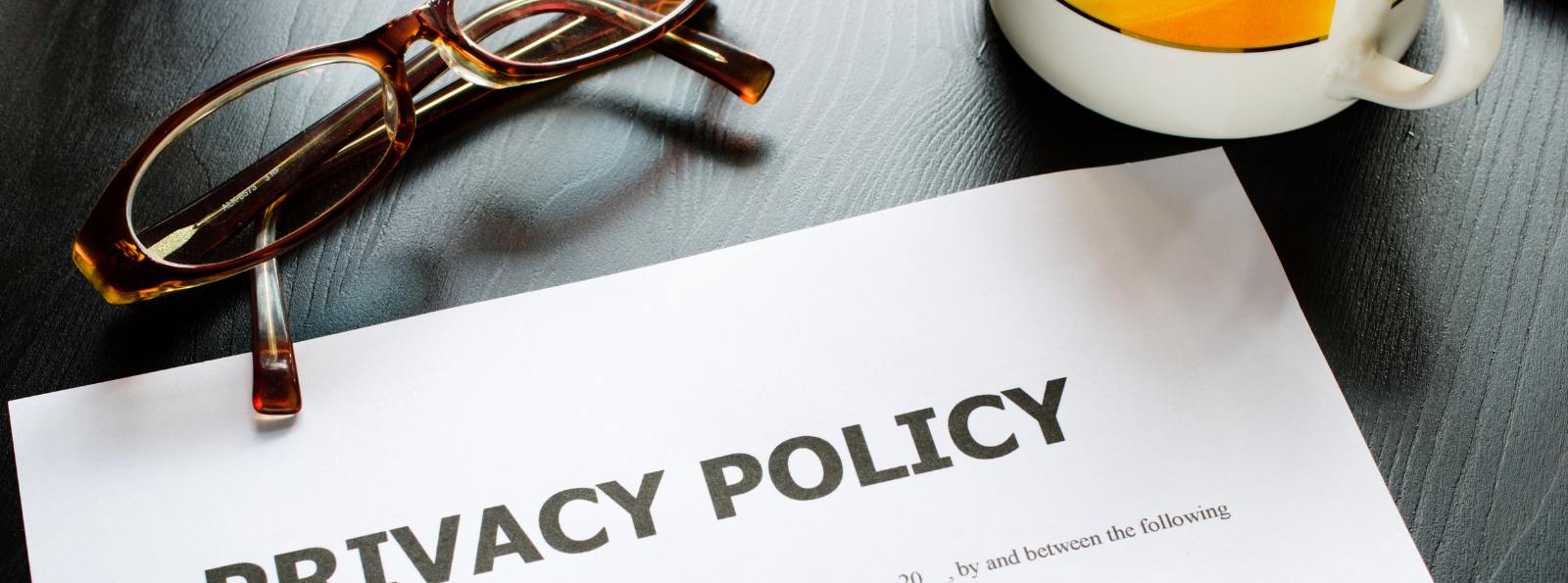 document title "Privacy Policy" laying on a table