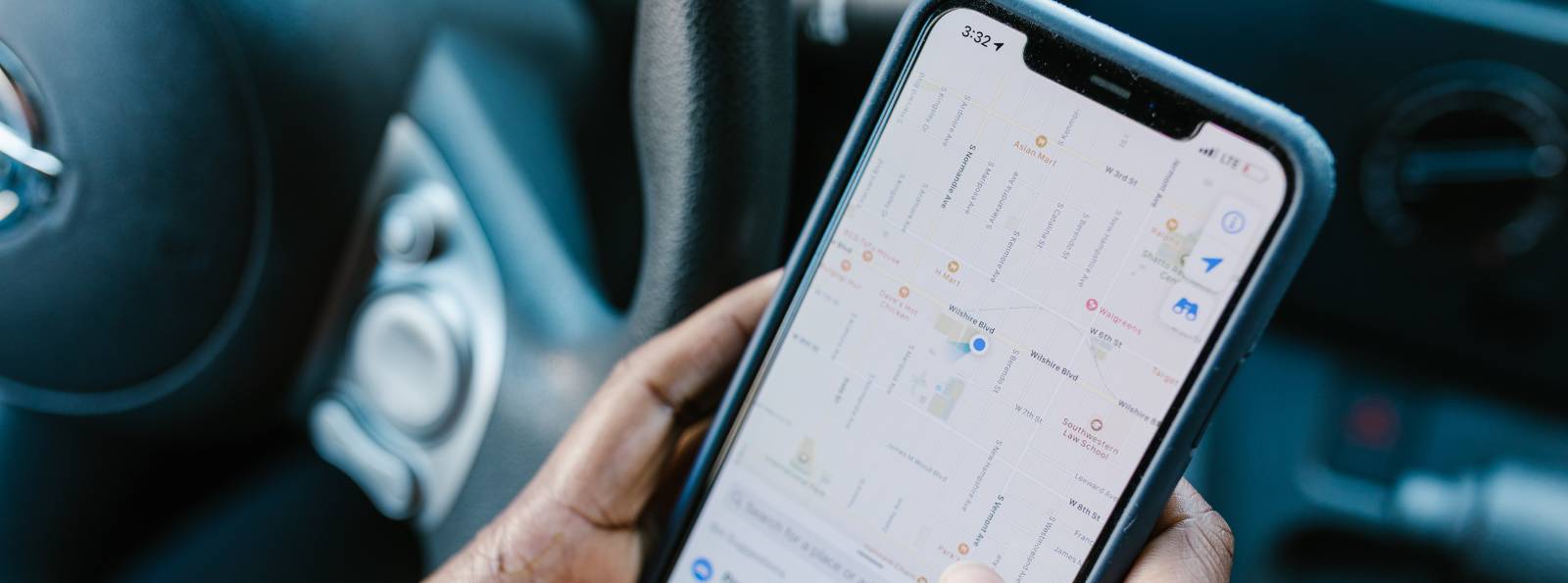 phone screen of someone in their car trying to navigate